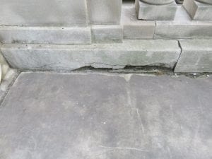 Joint failure between building and sidewalk